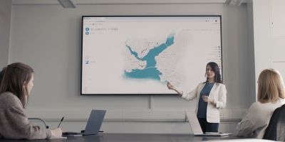 A person showing something on a display.